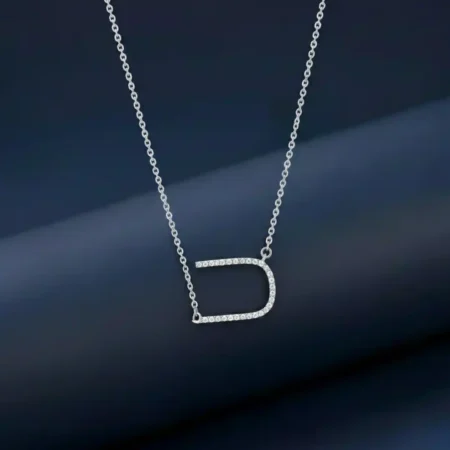 A sparkling silver chain pendant for women in an Alphabet U horseshoe shape.
