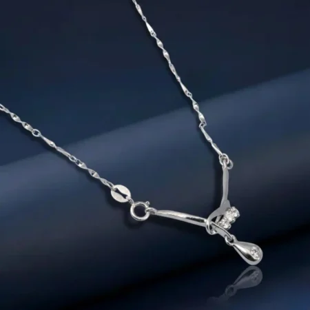 Timeless Silver Drop Chain Pendant with a sparkling crystal and unique chain by The VelvetBox.