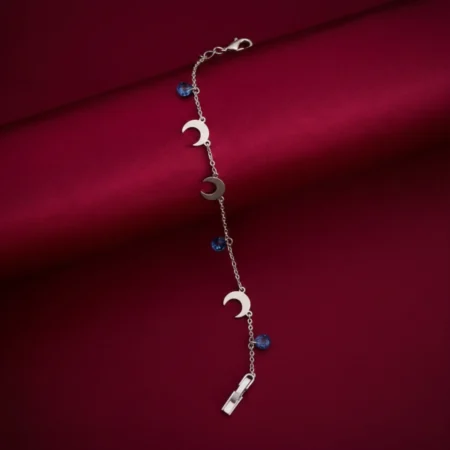 "Celestial Dreams: Moon and Sapphire Charm Bracelet"