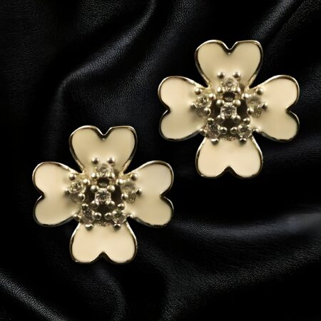 Elegant silver flower drop earrings with delicate floral design on black background – The Velvet Box Jewelry.
