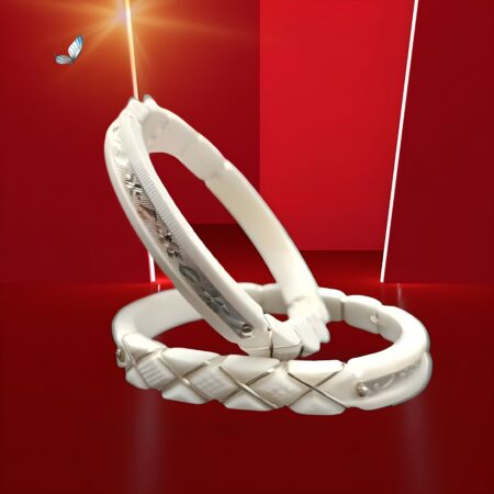 Stylish pair of white belly bangles with engraved silver patterns and a glossy, modern finish