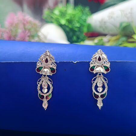 Intricately designed long silver earrings with red and green enamel accents, floral and teardrop motifs