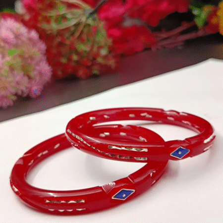 A pair of traditional silver Pola bangles with a smooth, polished finish, showcasing a minimalist and elegant design.