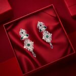Elegant silver-toned ethnic earrings with intricate design and colorful gemstone accents.
