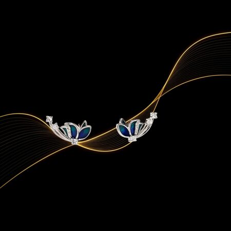 A pair of silver earrings featuring a stylized floral design with blue and teal enamel petals and small clear stones along the curved stems.