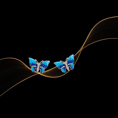A pair of silver butterfly-shaped earrings with blue enamel wings