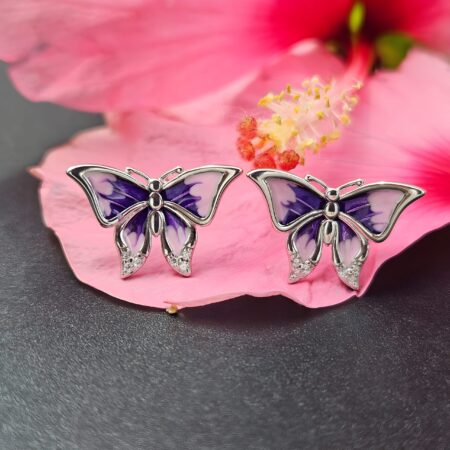 Luxury 925 silver butterfly earrings with purple wings on pink background