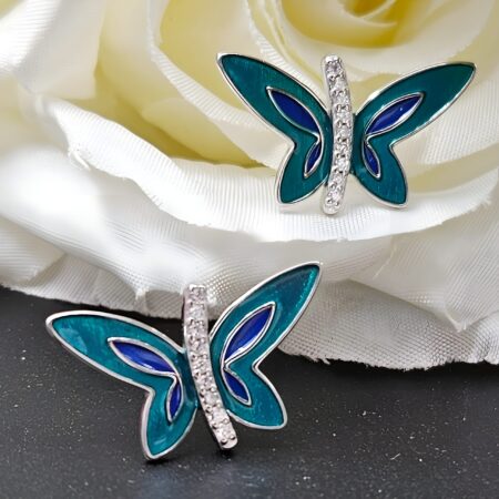 Sterling silver butterfly stud earrings with deep teal wings from The Velvet Box