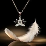Stone-studded crown-shaped silver locket pendant
