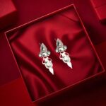 Traditional handcrafted silver earrings with intricate detailing and dangler design