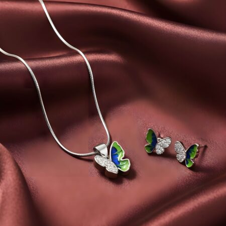 Silver butterfly jewelry set with green and black enamel wings, including a pendant on chain and matching stud earrings with crystal accents.