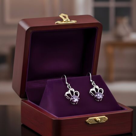 Elegant silver dangle earrings featuring a sleek, shiny finish with a modern, minimalist design, perfect for both casual and formal wear.