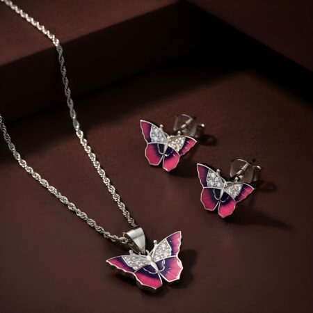 Elegant silver butterfly jewelry set with purple and pink enamel wings, featuring a pendant necklace and matching stud earrings adorned with sparkling stones