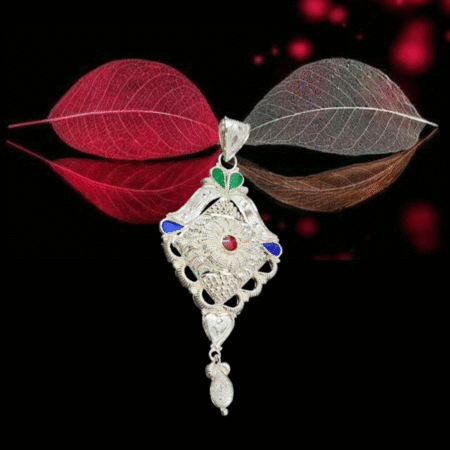 Intricately designed silver locket with square floral motif, featuring red, green, and blue enamel accents and a detailed hanging charm