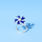 Elegant silver nose pin featuring a blue enamel floral design with a central opal stone.