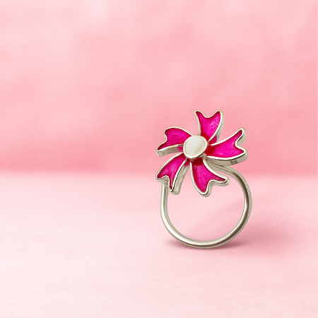 Silver nose pin with a floral design featuring bright pink enamel petals and a polished silver center