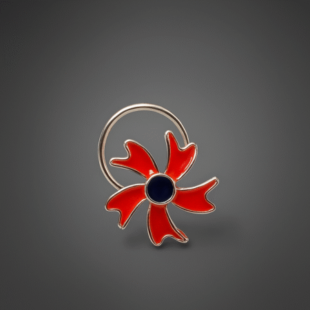 Silver nose pin with a bold floral design featuring vibrant red enamel petals and a dark blue central stone