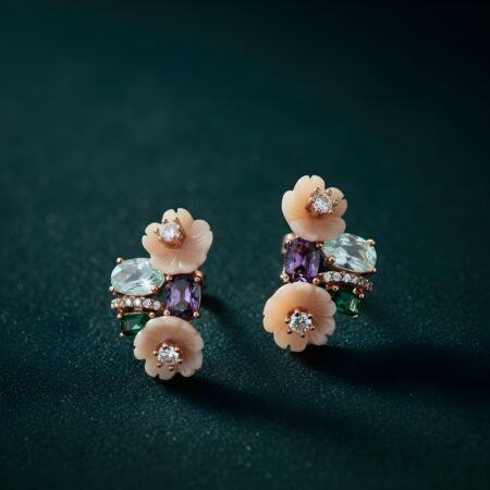 Elegant floral stud earrings featuring soft peach flowers with sparkling center stones, accented by green, purple, and aqua gemstones in a stylish cluster design.