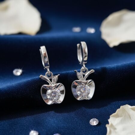 Elegant silver apple-shaped drop earrings featuring sparkling cubic zirconia stones and a sleek polished finish, designed for women and girls.