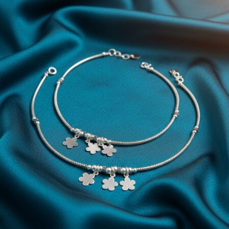Silver women’s anklet with delicate floral charms and adjustable clasp