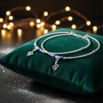 Pair of 925 sterling silver anklets for women with blue evil eye beads and snake charm, featuring elegant oxidized detailing
