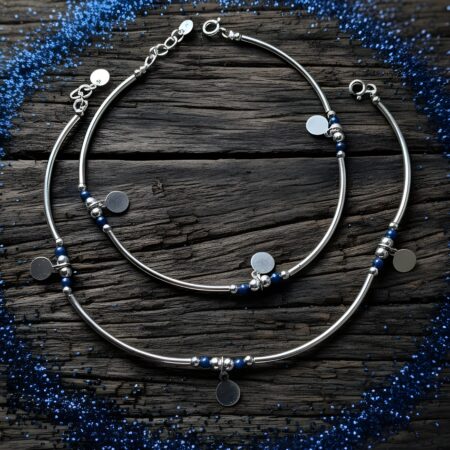 Pair of 925 sterling silver anklets for women featuring blue beads and round dangling charms, designed with a sleek and elegant finish.