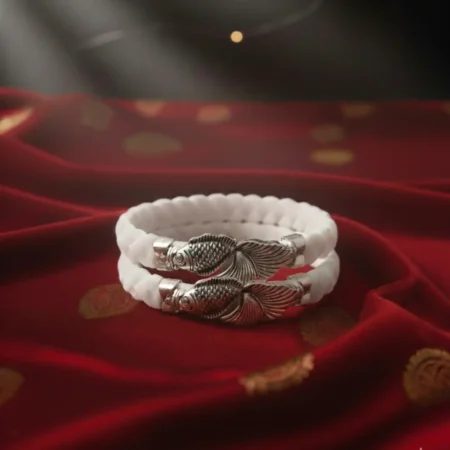 Traditional Silver Shakha Jewelry featuring a silver elephant motif and blue-green teardrop gemstones by The Velvet Box.