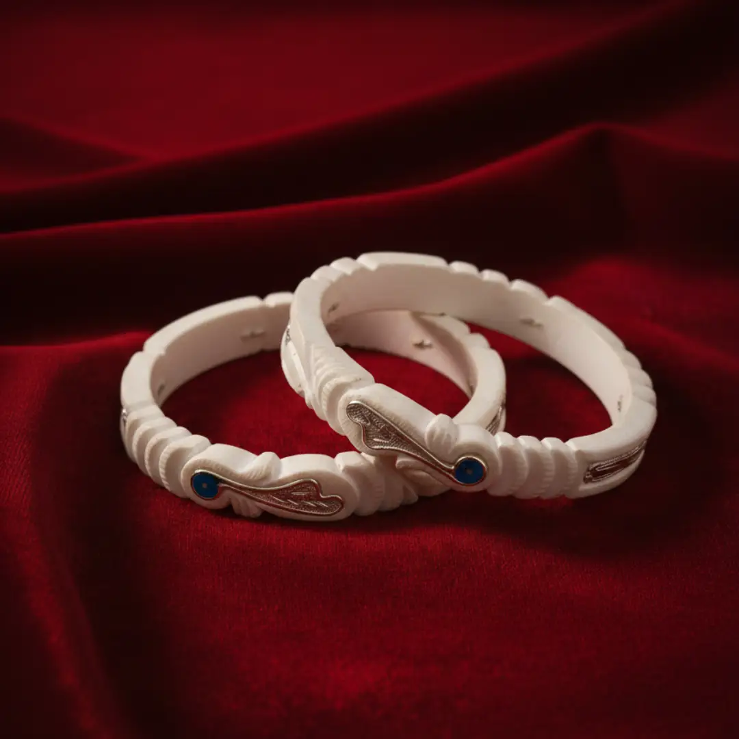 Bengali Shakha Bangles in 925 sterling silver with red and green stone inlays by The Velvet Box.