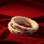 Wedding Special Bengali Sakha featuring a silver elephant motif and blue-green teardrop gemstones by The Velvet Box.