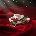 Designer Bengali Sakha Bangles featuring a silver elephant motif and blue-green teardrop gemstones by The Velvet Box.