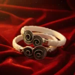 Luxury Silver Shakha Bangles featuring a silver elephant motif and blue-green teardrop gemstones by The Velvet Box.